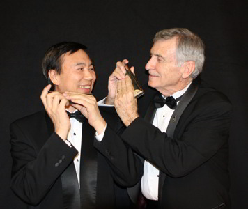 Photograph of harmonica players Jiayi He and Tom Stryker