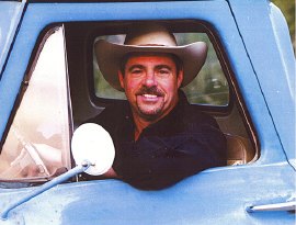 Photograph of Richard Elloyan in blue truck