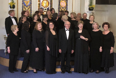 Photograph of Carson Chamber Singers laughing in St. Peter's Episcopal Church