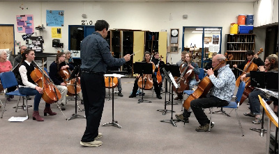 Photograph of Framil leading a Cello Workshop in Carson City in 2018.