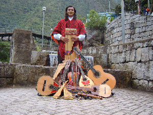 Photograph of Carlos Fernando Ocampo of Kantu Inka with Peruvian instruments.