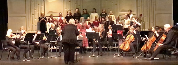 Photograph of Symphony Youth Chorus performing with NQR, Nancy Jones and Sue
  McGarraugh, conductors, Dec. 11, 2025